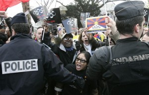 What is wrong with this picture? answer - since when do protester\'s carry signs with corporate logos on them? 